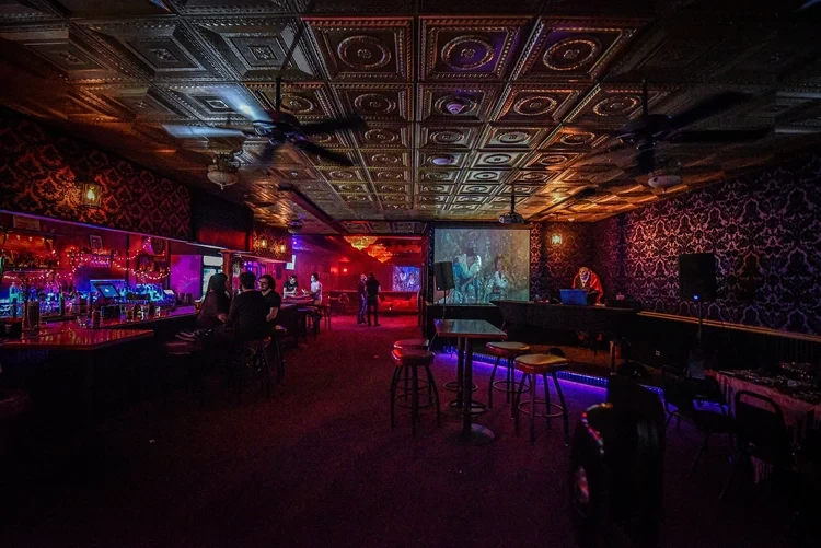 Interior of Photo City Music Hall with red and purple lighting